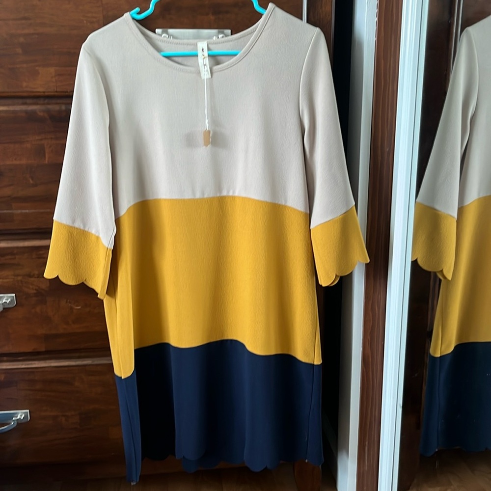 Quarter sleeve dress, scalloped sleeves and bottom. NWT